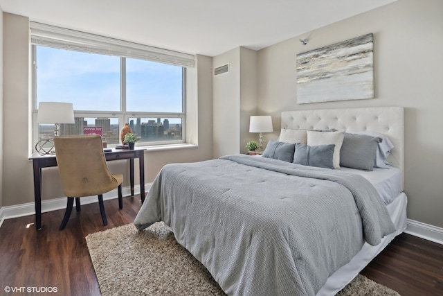 bedroom featuring dark wood-type flooring