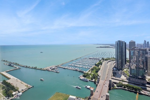 birds eye view of property featuring a water view