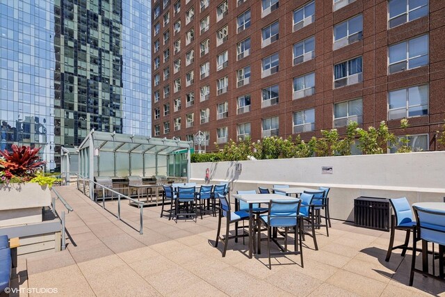 view of patio featuring a grill and a pergola