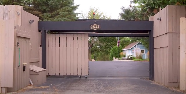 view of gate featuring fence