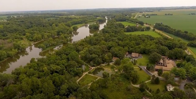 bird's eye view featuring a water view and a view of trees