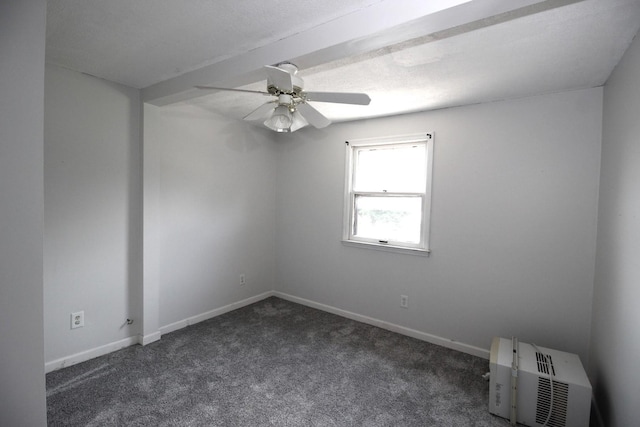 unfurnished room featuring ceiling fan and dark carpet