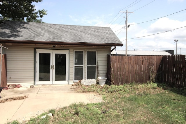 rear view of property featuring a patio area and french doors