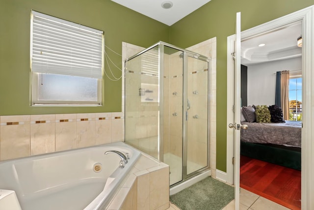 bathroom with plus walk in shower and tile patterned flooring