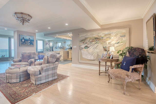 living room with ornamental molding and light wood-type flooring