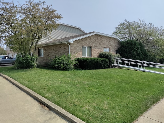 view of home's exterior featuring a yard