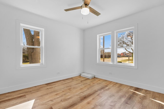 unfurnished room with ceiling fan and light hardwood / wood-style floors