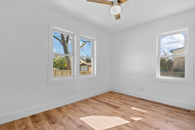 empty room featuring ceiling fan and light hardwood / wood-style flooring