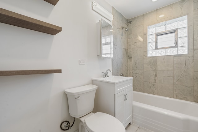 full bathroom with toilet, tile patterned floors, tiled shower / bath, and vanity