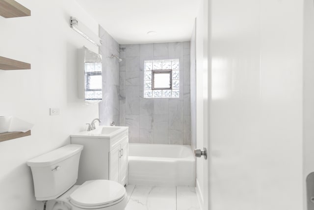 full bathroom with toilet, tiled shower / bath, and vanity