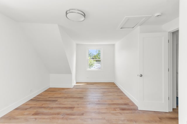 additional living space featuring light hardwood / wood-style flooring