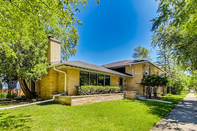 split level home with a front yard