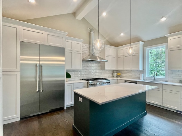 kitchen featuring lofted ceiling with beams, decorative backsplash, high quality appliances, and dark hardwood / wood-style floors