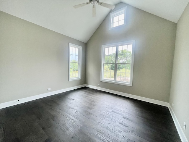 spare room with ceiling fan, dark hardwood / wood-style floors, high vaulted ceiling, and a wealth of natural light