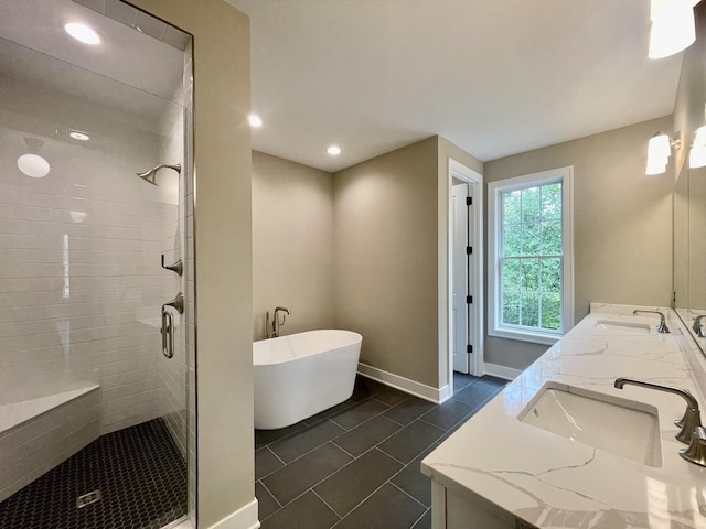 bathroom featuring tile patterned floors, shower with separate bathtub, and vanity