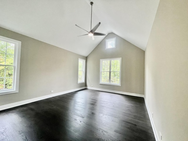 unfurnished room with dark wood-type flooring, ceiling fan, and vaulted ceiling