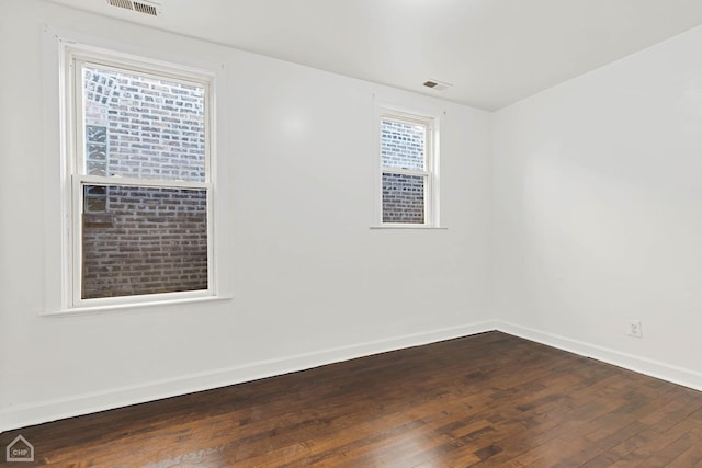 empty room featuring hardwood / wood-style flooring