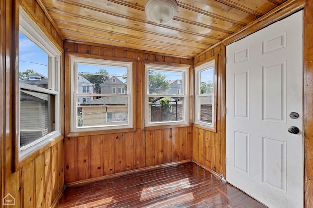 unfurnished sunroom with wooden ceiling