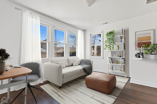 living area featuring hardwood / wood-style floors