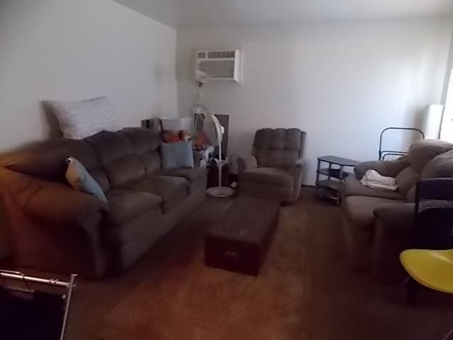 living room featuring dark carpet and an AC wall unit