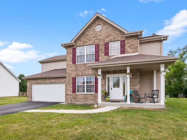 view of front facade with a front yard and a garage