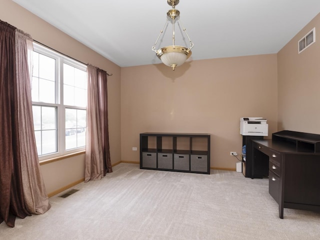 office featuring light colored carpet, visible vents, and baseboards