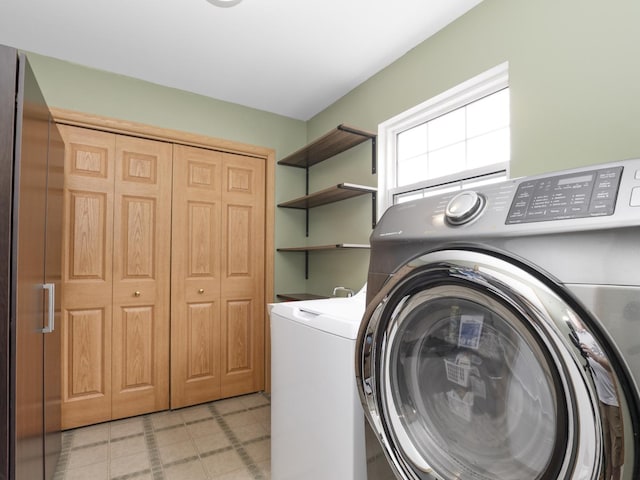 laundry room featuring washer and dryer, laundry area, and light floors