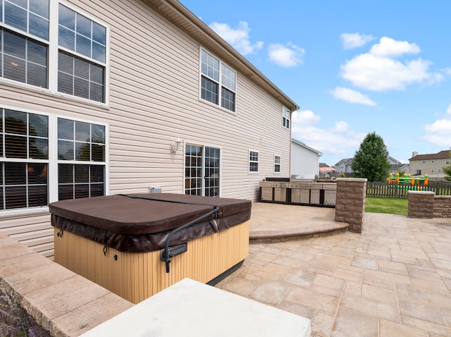 view of patio / terrace featuring grilling area and a hot tub