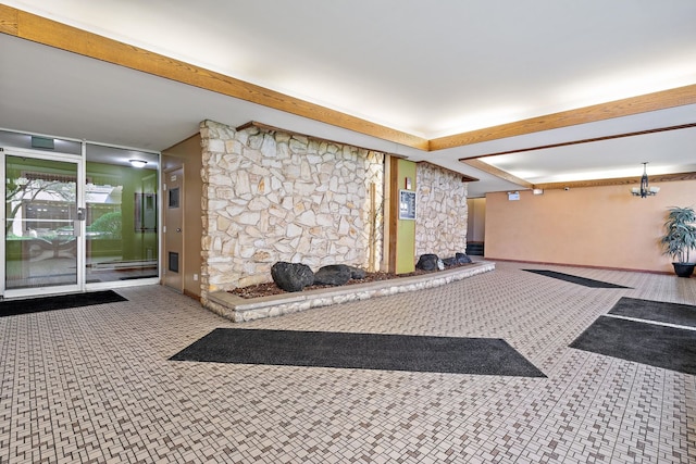 living room with a fireplace and beamed ceiling