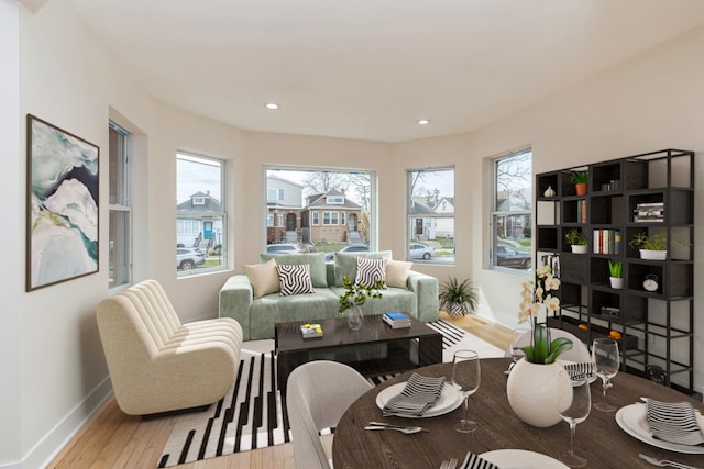 living room featuring a healthy amount of sunlight and hardwood / wood-style flooring