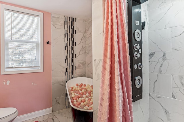 bathroom featuring toilet and walk in shower