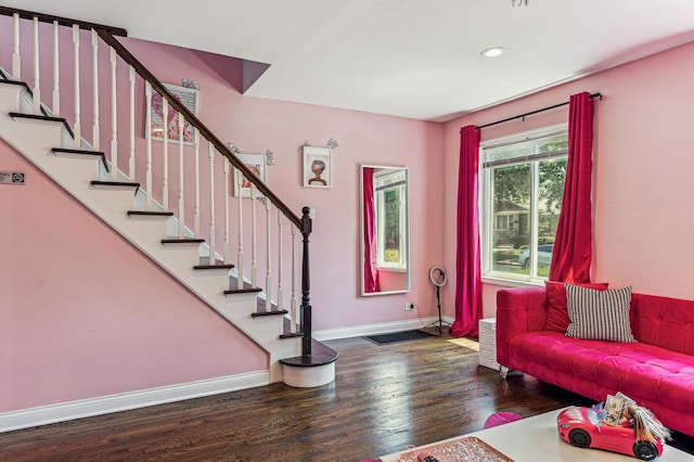 living room with dark hardwood / wood-style flooring