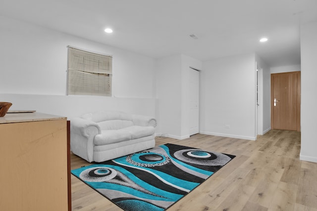 living room with light hardwood / wood-style flooring