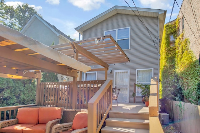 wooden terrace featuring outdoor lounge area and a pergola