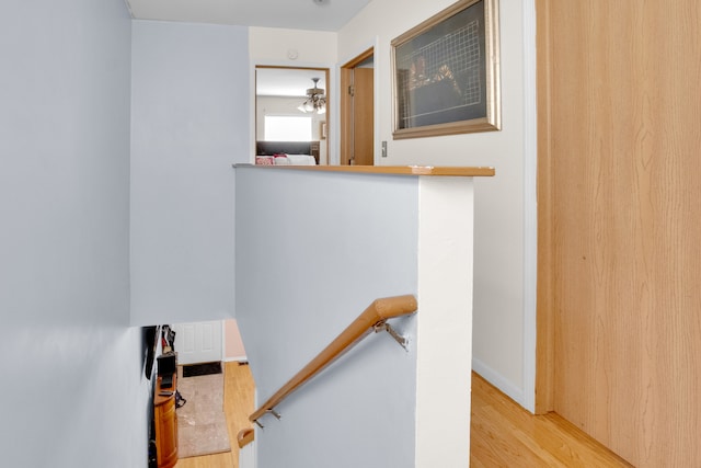 stairs featuring hardwood / wood-style floors