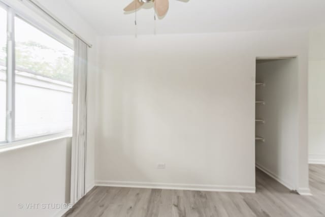 spare room with ceiling fan and light hardwood / wood-style flooring