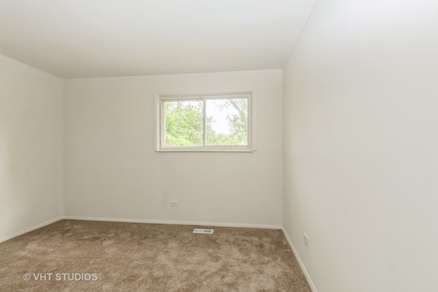 empty room with light colored carpet