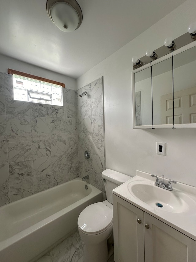 full bathroom featuring toilet, tile patterned floors, tiled shower / bath combo, and vanity