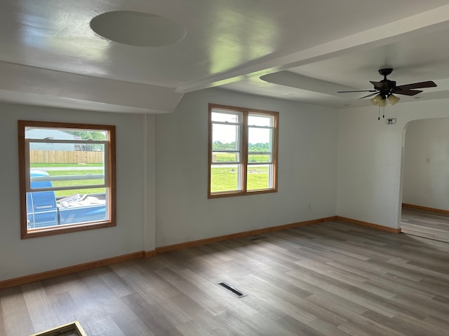 unfurnished room featuring hardwood / wood-style floors and ceiling fan