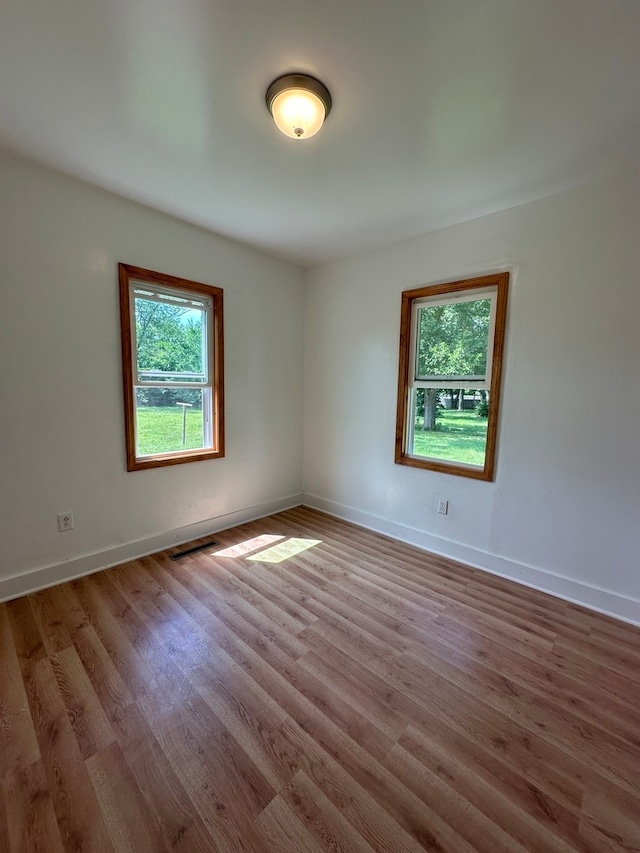 spare room featuring hardwood / wood-style floors