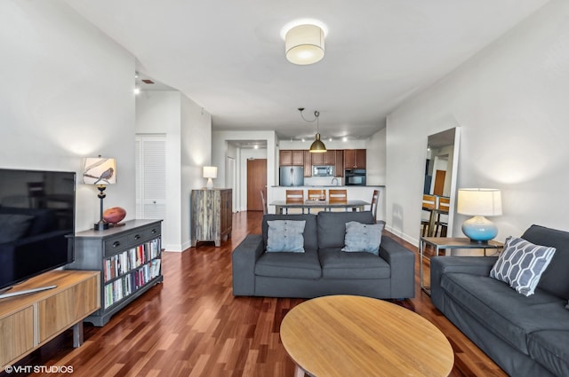 living room featuring dark hardwood / wood-style flooring