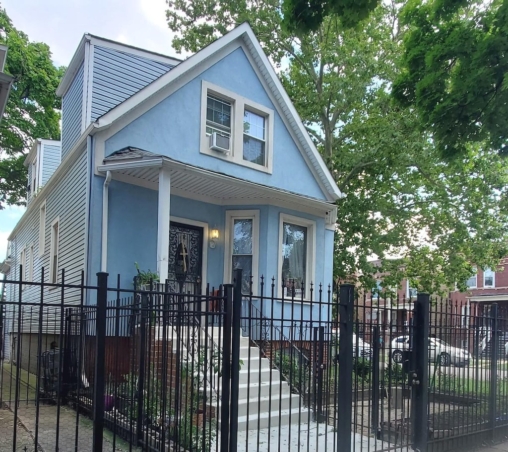 view of front of property with covered porch and cooling unit