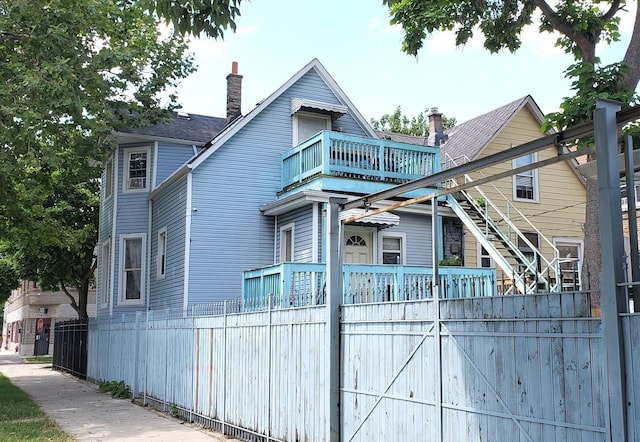 view of front facade with a balcony