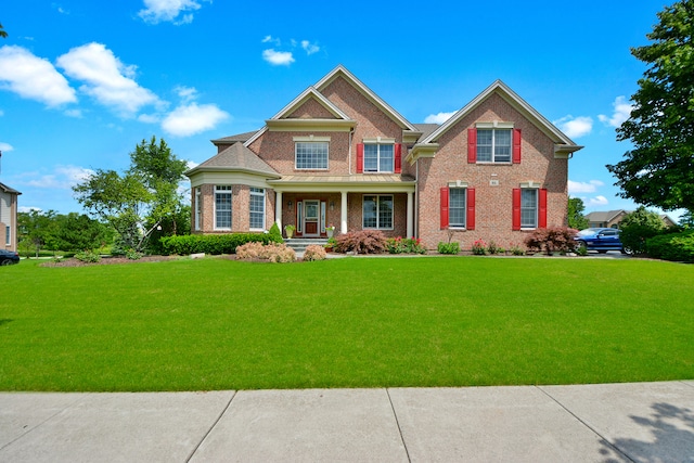 craftsman-style home featuring a front lawn