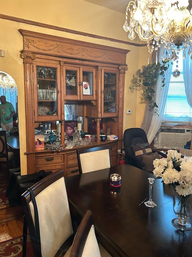 dining space featuring a chandelier and wood-type flooring