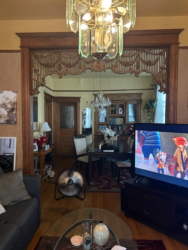 living room featuring a notable chandelier and hardwood / wood-style floors