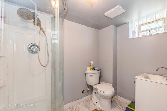 bathroom with an enclosed shower, sink, and toilet