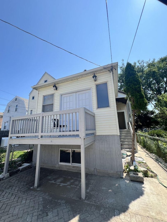 rear view of property with a deck