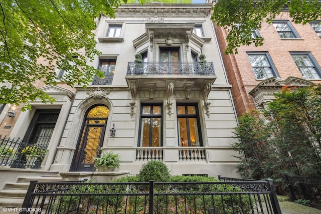 view of front facade with a balcony