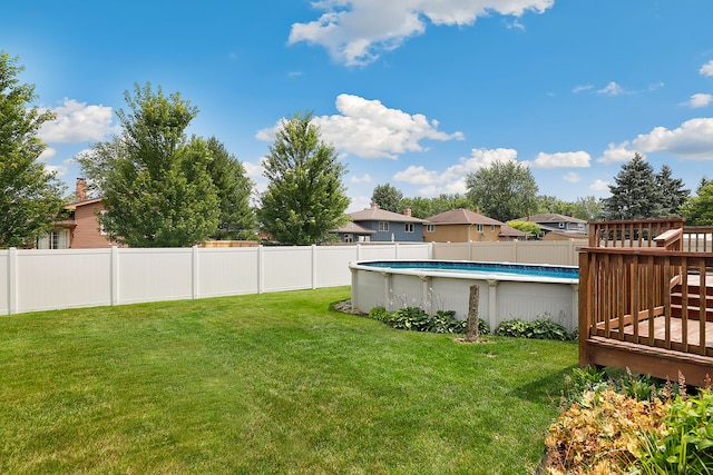 view of yard featuring a swimming pool side deck